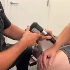 Shockwave therapy applied to a patient’s wrist.