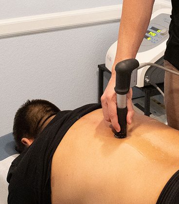 Therapeutic soft tissue treatment applied to the back to reduce tension and support recovery