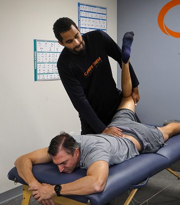 Assisted leg and hip stretch to improve flexibility, mobility, and recovery