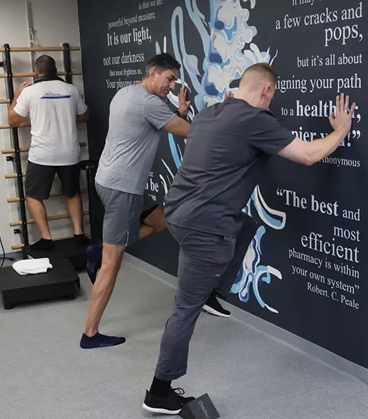 Guided wall stretch and mobility exercise to improve balance, flexibility, and lower body control