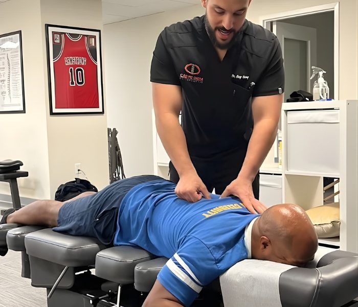 carpe diem chiropractor performing spinal adjustment at customers location, using the mobile workplace wellness service